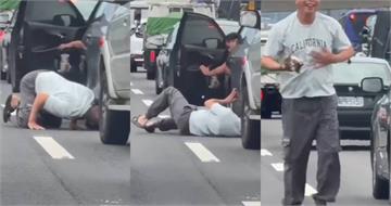 阿伯車陣中突趴地鑽車底！網誤會「在跳Breaking」　見結局讚爆：好人平安