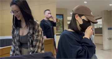 太子集團「爆乳女特助」現身北檢！　戴韓國潮帽穿大學長T不發一語