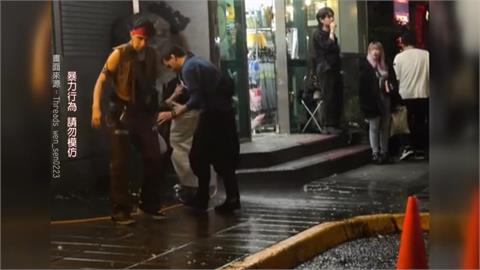 清潔婦不滿人群占據道路潑水驅趕　遭年輕男子怒砸酒瓶