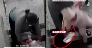 婦人抱嬰走樓梯滑手機！險滑倒竟鬆手「頭重擊地板」　監視器畫面曝