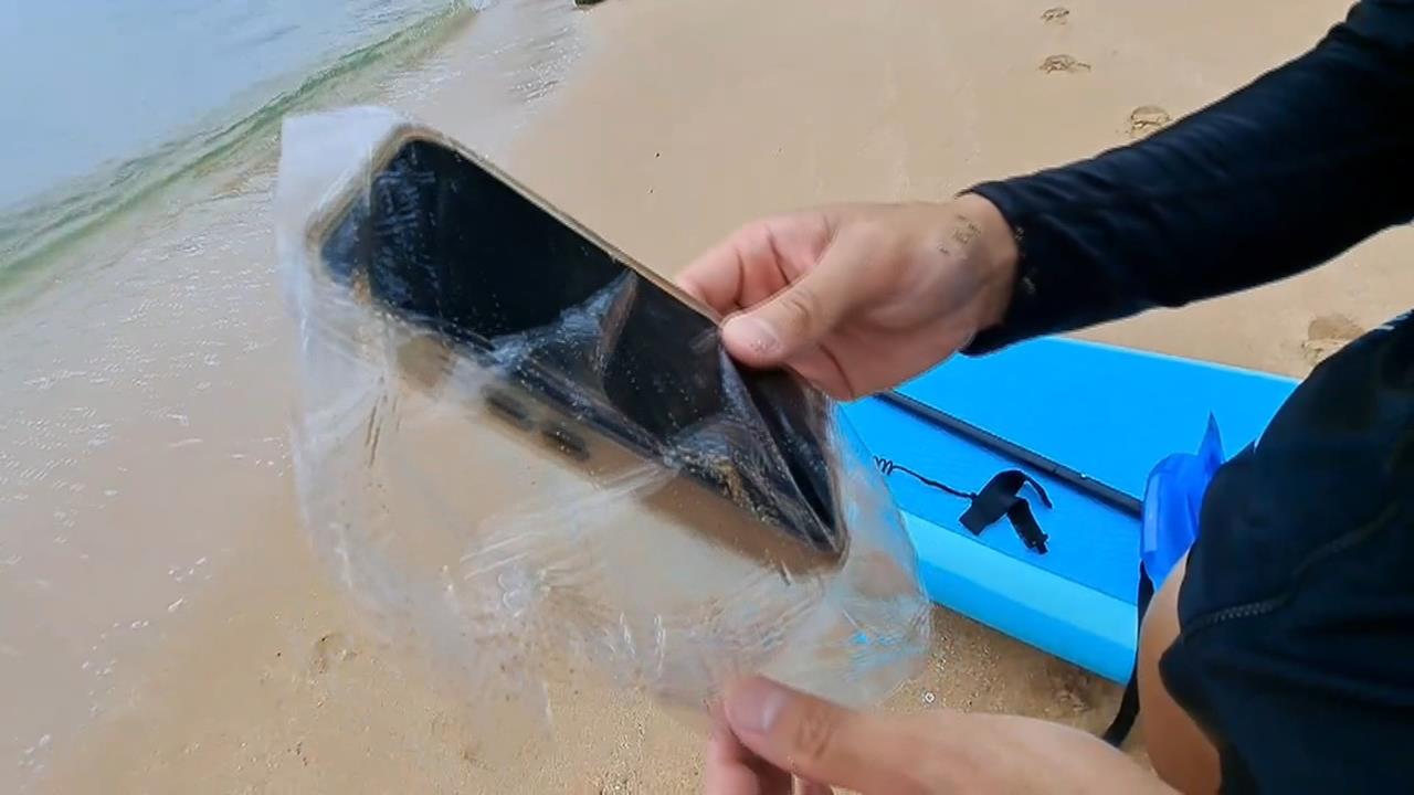 大海撈機！男划SUP、手機腰包落海 奇蹟失而復得