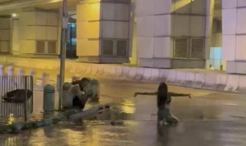 香港熱褲妹颱風天跪地擺POSE拍「濕身照寫真」　男伴1舉動網熱議